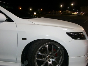 Toyota Camry with white carbon fiber DI-NOC wrapped hood