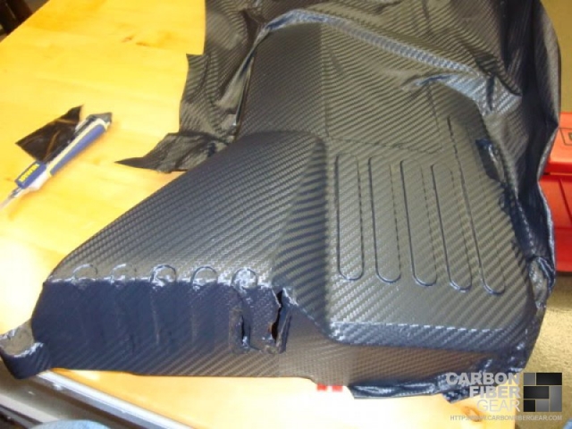 Fenders being wrapped in 3M carbon fiber film