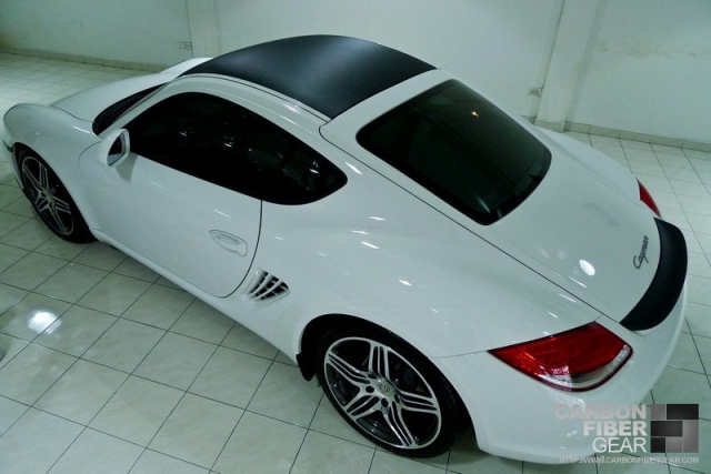 White Porsche Cayman with carbon fiber 3M DI-NOC